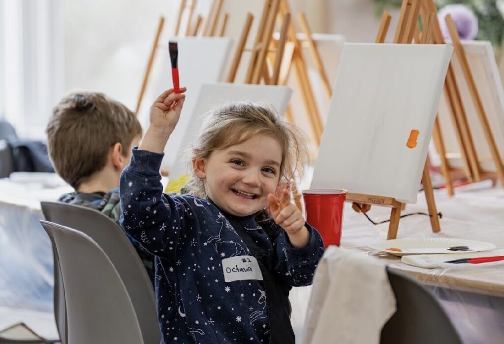 A child painting during an NDIS Art Therapy workshop in Hoppers Crossing.